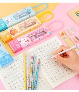 Close-up of colorful 5-in-1 stationery set with pencils, ruler and sharpener in gift boxes
