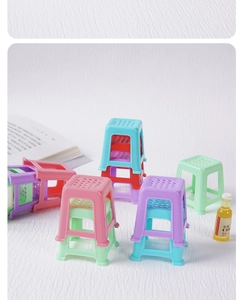 Miniature dollhouse plastic stools in assorted colors with anti-slip hole detail