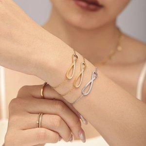 Infinity pendant necklace and ring set with zircons in gold and silver finish