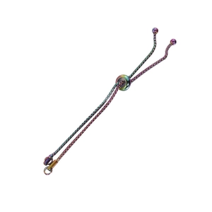Macro detail of rainbow stainless steel adjustable bolo box chain with slider bead