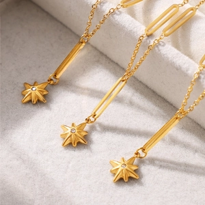 Gold plated eight-pointed star pendant necklace with cubic zirconia on geometric chain