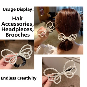 Detail of white pearl bow hair accessories showing hair tie and clip with elegant beadwork