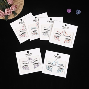 Flat lay of six colorful acrylic face gem sticker designs for festival makeup