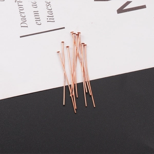 Close-up of rose gold stainless steel T-pins for DIY jewelry making and beading projects