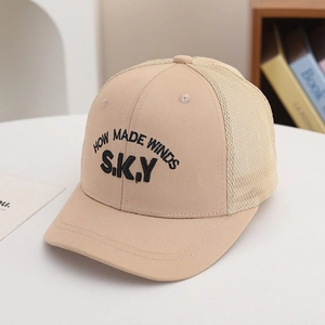 Close-up of beige mesh baseball cap featuring detailed black letter embroidery on front
