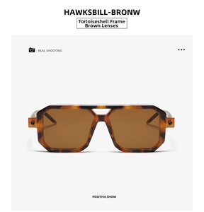Detailed front view of tortoiseshell double-bridge sunglasses with brown lenses