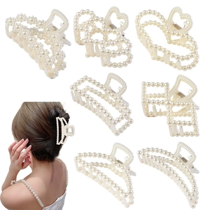 Detailed set of seven white pearl hair claws in various geometric shapes with model demo