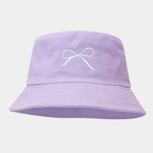 Close-up of lavender cotton bucket hat with white bow embroidery and detailed stitching
