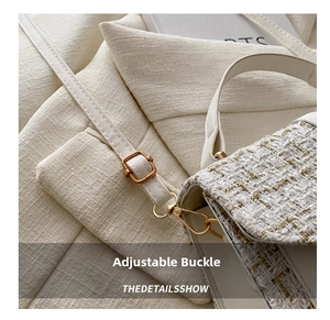 Detail of tweed fabric with gold threads and adjustable champagne gold buckle strap