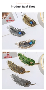 Detail of leaf hair clip showing hollow feather with blue gemstone and bee design