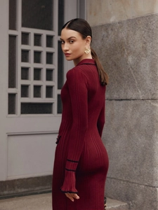 Elegant wine red ribbed knit midi dress with bell sleeves and black contrast trim detail