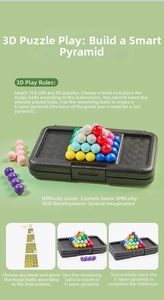 Detail view of 3D pyramid puzzle showing multi-colored beads and grid base for logic training