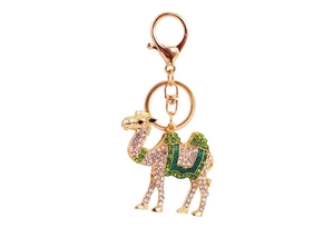 Detailed view of camel keychain with green and white rhinestones and gold-plated hardware