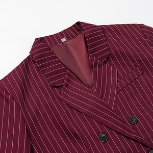 Detail of notched lapel and black resin button on burgundy pinstripe suit jacket