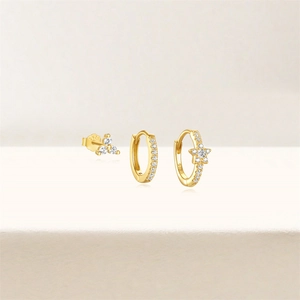 Macro shot of 18K gold-plated S925 silver earrings set with sparkling white zircon stones