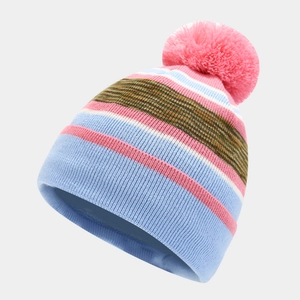 Detail of striped knit beanie with large pink pom-pom and warm fleece lining