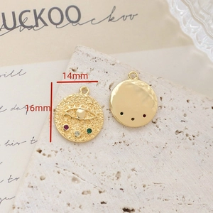 Detailed macro view of 14mm gold-plated evil eye charm with colorful zircon inlay