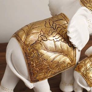 White resin elephant statues with gold leaf patterns for modern home office decor