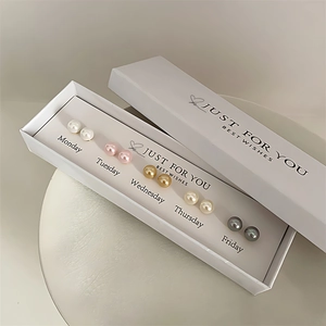 5-pair pearl stud earring gift set in white box with weekly labels and elegant design
