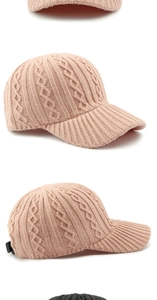 Close-up of pink cable knit baseball cap showing detailed stitch texture and warm fabric