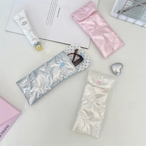 Quilted bow texture PU leather sunglasses pouches in silver, pink, and off-white colors