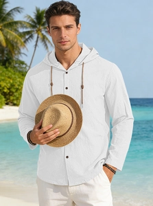 White linen textured cotton hooded shirt for men styled in a tropical beach setting