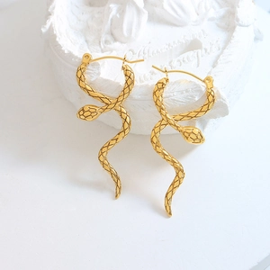 Elegant gold snake wrap earrings with a minimalist coiled design on a white background