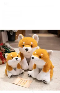 Three sizes of plush Shiba Inu dog dolls displayed on a cozy beige carpet in a home setting