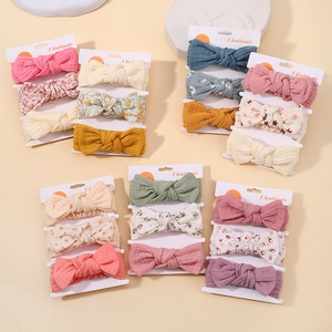 Detailed flat lay of three-piece baby bow headband sets in assorted floral prints