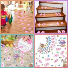 Detail showing easy to peel Easter bunny footprint floor stickers on wood stairs