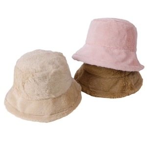 Fuzzy faux fur bucket hats in beige, pink, and brown with a soft plush texture