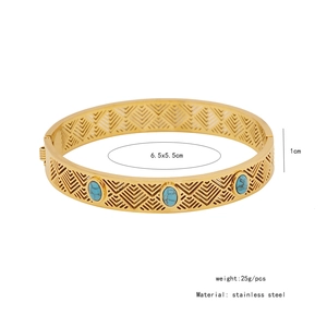 Detail view of gold stainless steel cutout bracelet with turquoise stones and size specs