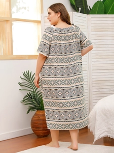 Detailed back view of plus size bohemian loungewear with lace sleeves and geometric print