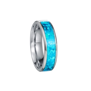 Detail of silver titanium steel ring featuring inlaid blue synthetic opal scales