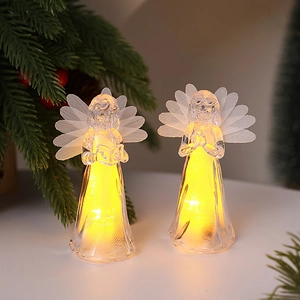 Close-up of LED acrylic crystal angel ornaments with warm lights and feather wings