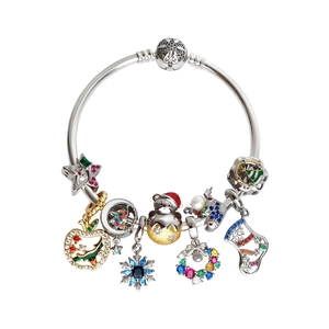 Christmas charm bracelet with silver snowflake and reindeer pendants in high detail