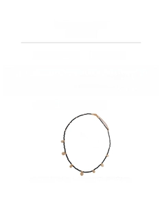 Detail view of black crystal beaded necklace with copper coin pendant and lobster clasp