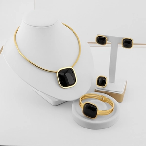Elegant gold titanium steel jewelry set featuring square black cat eye stones for women