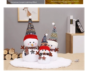 Detailed trio of plush Christmas snowman dolls with knit hats and scarves on snowy base