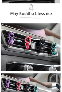 Detail of colorful cartoon astronaut bear air vent clips for car interior decoration