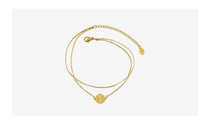 Detail of 18K gold double-layer chain anklet with circular cutout Fu character pendant