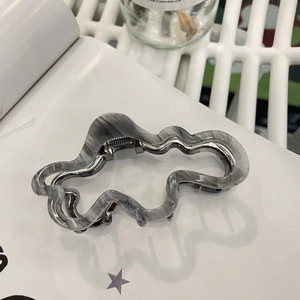 Elegant grey marble acetate cloud hair claw clip with wavy edge and silver metal spring