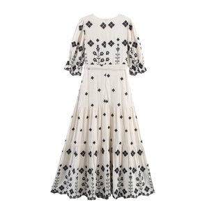 Bohemian off-white embroidered maxi dress with long puff sleeves and tiered skirt back view