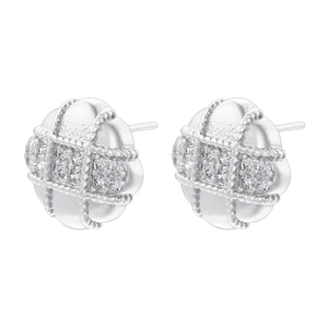 Macro detail of silver round stud earrings featuring a grid pattern and clear cubic zirconia