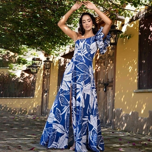 Detail of single-shoulder floral print swimsuit with ruffle sleeve and high slit skirt