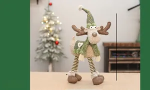 Detail of Christmas reindeer decor in green heart vest with knitted and plush textures