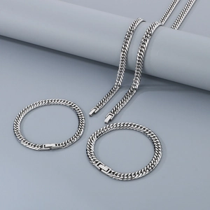 Silver stainless steel jewelry set including Cuban chain necklace and bracelets