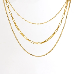 Three-layer gold stainless steel necklace featuring paperclip and box chain layering