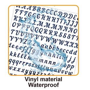 Macro detail of waterproof vinyl alphabet stickers showing water droplets on the surface