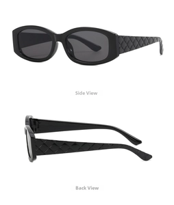 Detail view of oval sunglasses featuring black frames and textured quilted pattern temples
